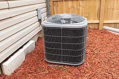 air conditioner has been properly installed and is cooling on a hot day