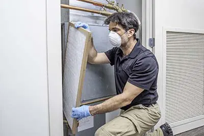 Replacing an air filter while wearing a mask